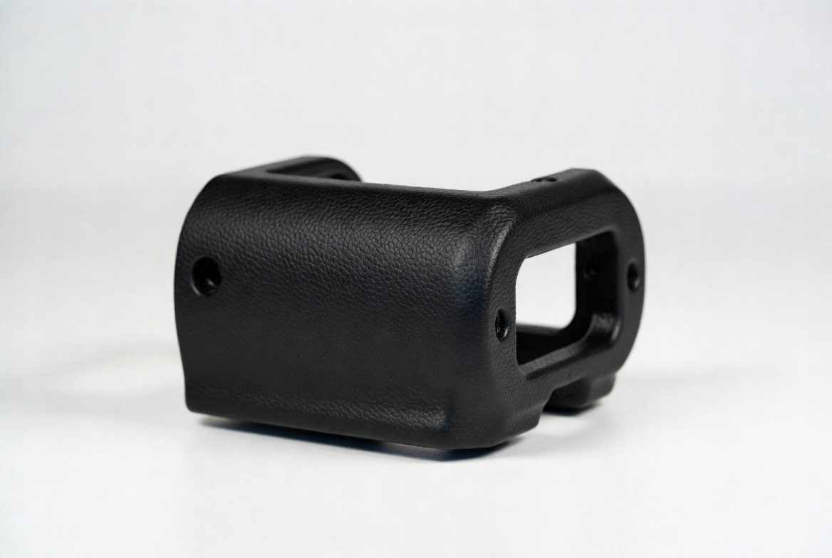 Integral skin urethane medical device housing with molded-in inserts and pebble-grain surface — RIM molded by Comcast Urethane
